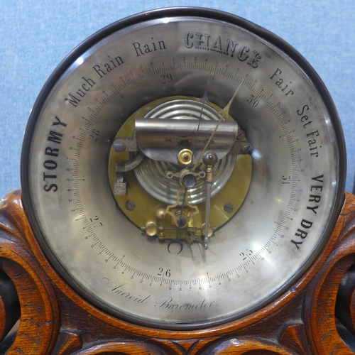 346 - Two Victorian carved oak aneroid barometers