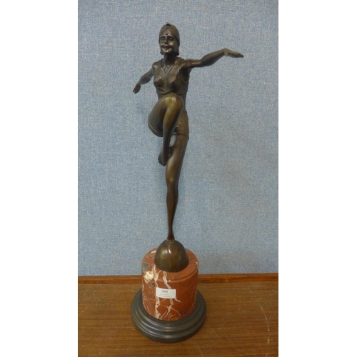 348 - An Art Deco style bronze figure of a female dancer, on rouge marble socle