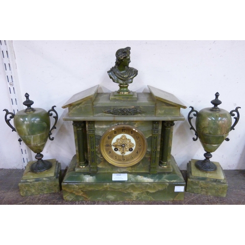 350 - A brass and onyx clock garniture