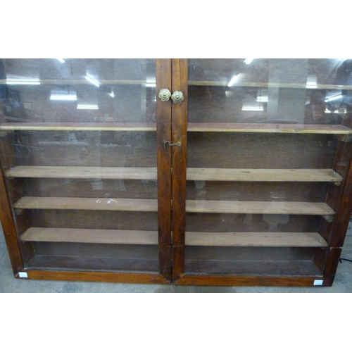 358 - A glazed mahogany display case