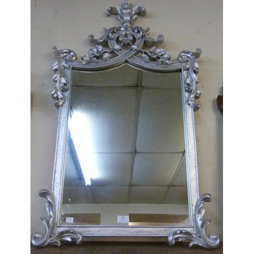 366 - A Rococo style silver effect framed mirror