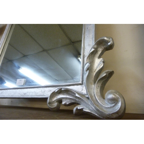 366 - A Rococo style silver effect framed mirror