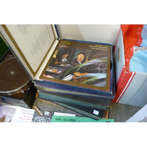 370 - A vintage H.M.V. portable gramophone and assorted records