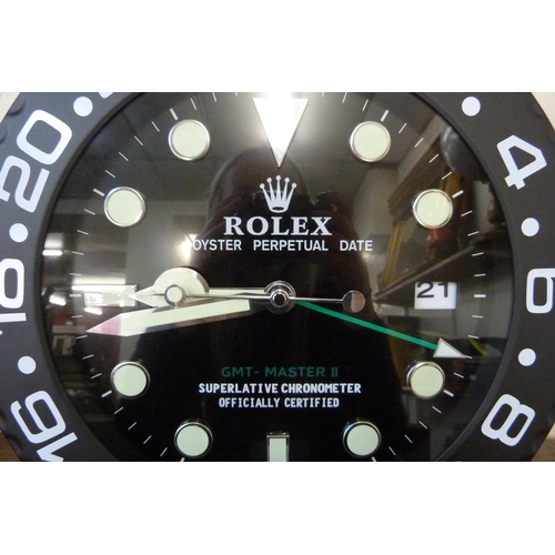 372 - A Rolex style dealer's display wall clock