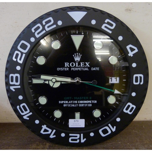 373 - A Rolex style dealer's display wall clock