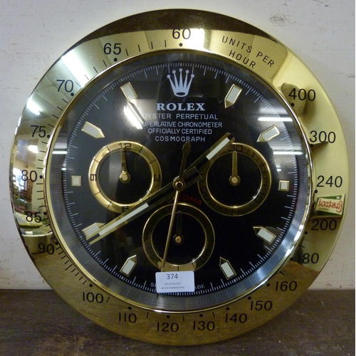 374 - A Rolex style dealer's display wall clock