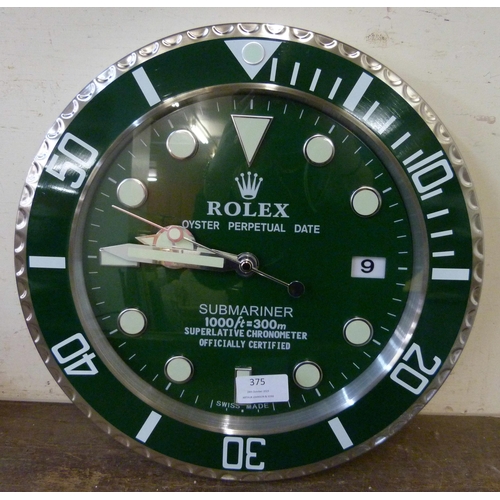 375 - A Rolex style dealer's display wall clock