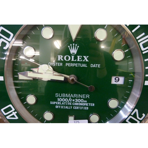 375 - A Rolex style dealer's display wall clock