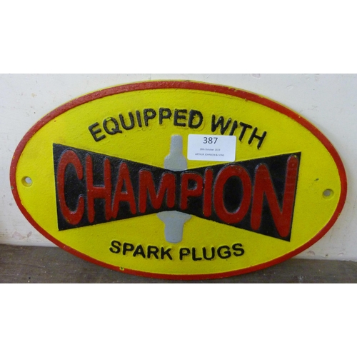 387 - A painted cast iron Champion Spark Plugs advertising sign