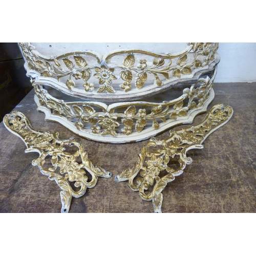 390 - A pair of cream and parcel gilt demi lune wall shelves