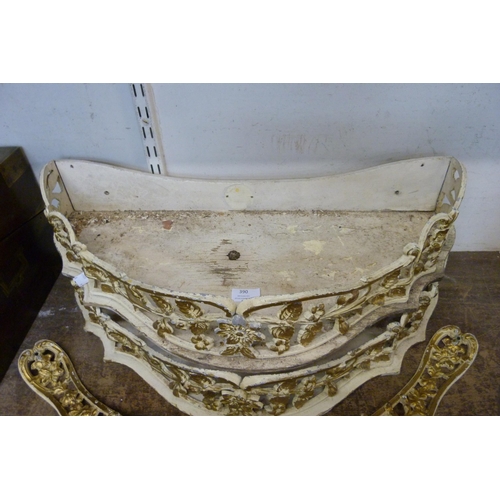 390 - A pair of cream and parcel gilt demi lune wall shelves