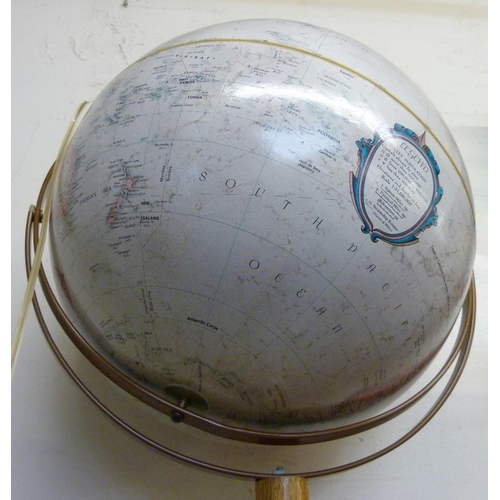 392 - A desk top terrestrial globe, on oak stand