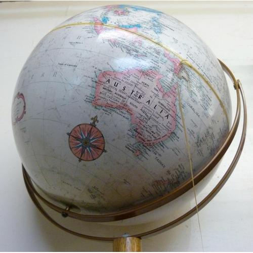 392 - A desk top terrestrial globe, on oak stand