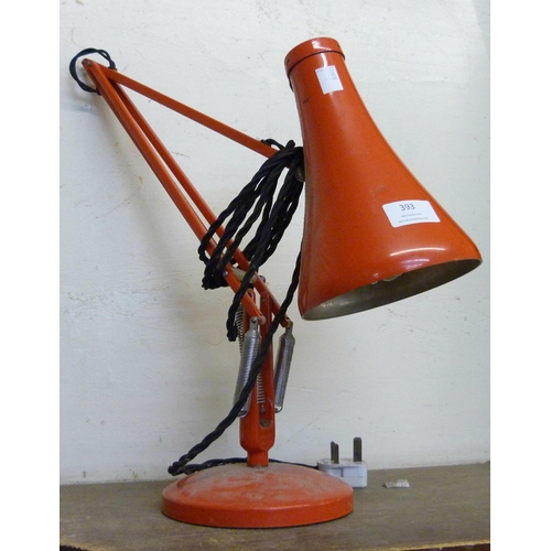 393 - A red metal anglepoise desk lamp