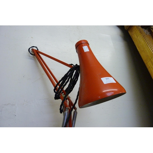 393 - A red metal anglepoise desk lamp