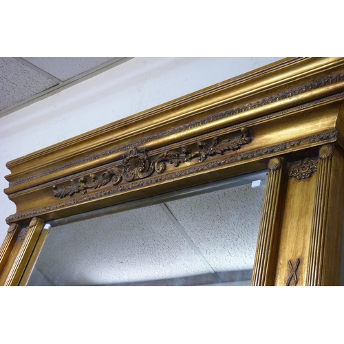 394 - A Regency style gilt framed overmantel mirror