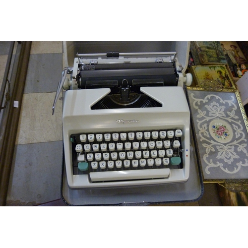 395 - An early 20th Century plywood box, a briefcase, handbag, typewriter, etc.