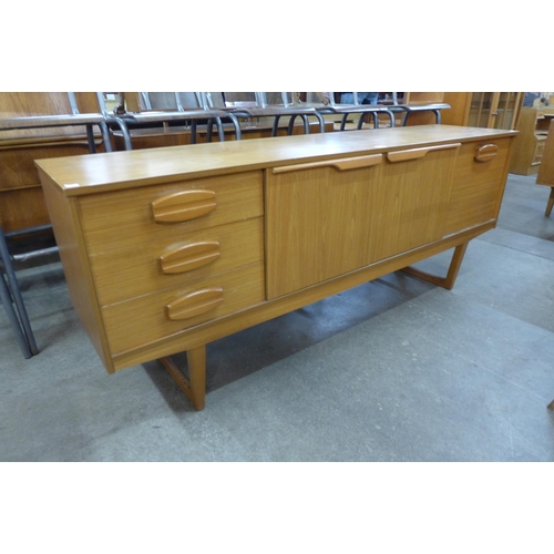 40 - A teak sideboard