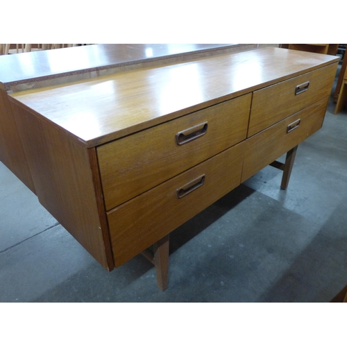 44 - A teak four drawer sideboard