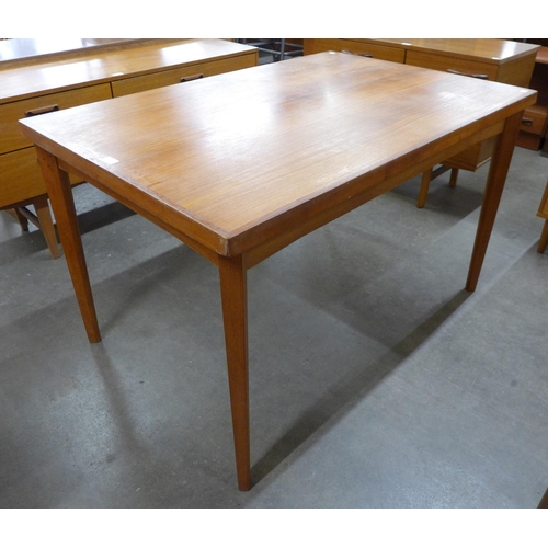 45 - A teak extending dining table