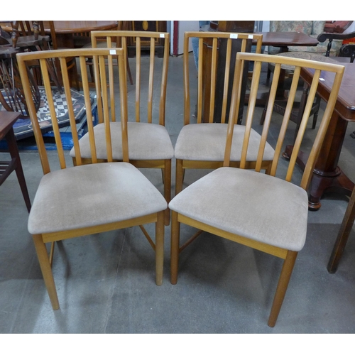 46 - A set of four teak dining chairs