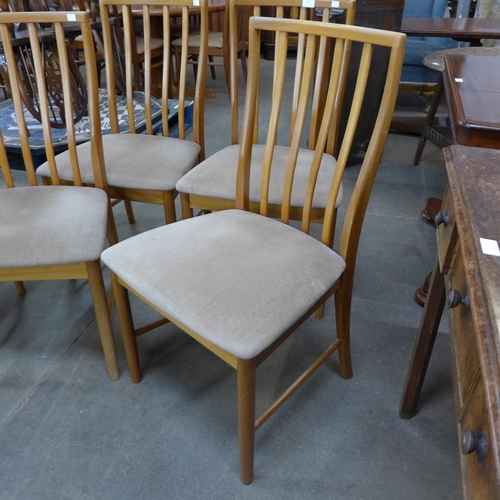 46 - A set of four teak dining chairs