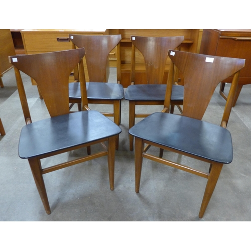 51 - A set of four teak dining chairs