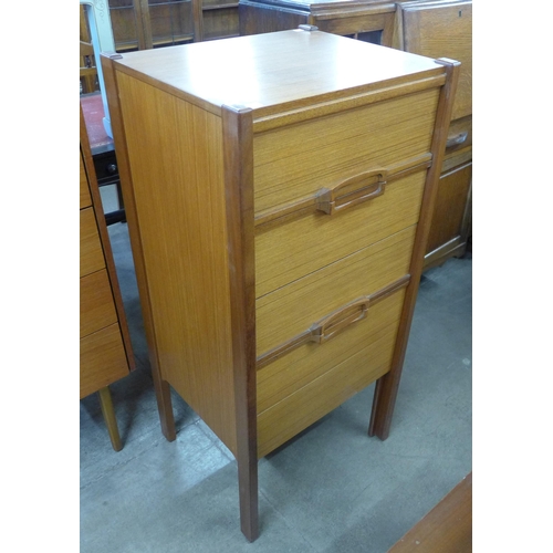 61 - A teak chest of drawers