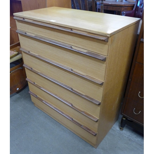 65 - A teak chest of drawers