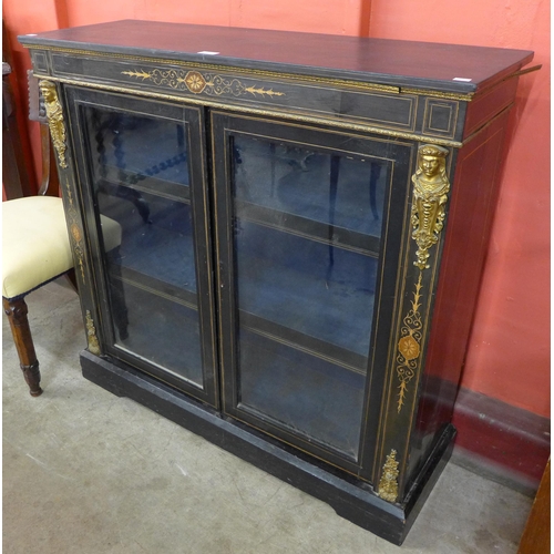 75 - A Victorian ebonised and gilt metal mounted pier cabinet