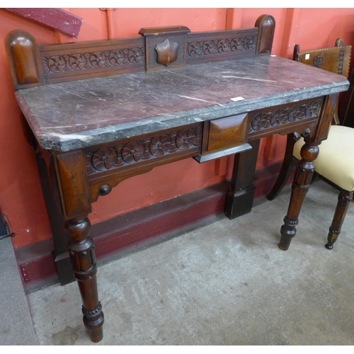 77 - A Victorian Gothic Revival mahogany and marble topped console table, stamped Widger Maker, Plymouth