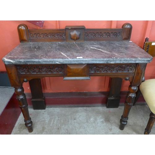 77 - A Victorian Gothic Revival mahogany and marble topped console table, stamped Widger Maker, Plymouth