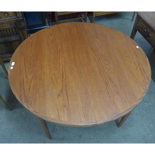 9 - A G-Plan Fresco teak circular extending dining table