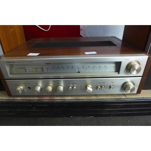 2204 - A Toshiba SA320L stereo receiver tuner and a pair of Revox BX230 speakers