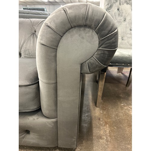 1467 - A grey velvet Chesterfield three seater sofa