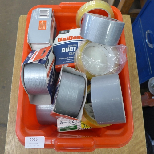 2029 - A plastic tub containing a quantity of mainly hand saws and G-clamps, also a quantity of other hand ... 