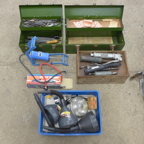 2015 - A quantity of assorted car parts and tools including foot pumps, grease guns and two metal toolboxes... 