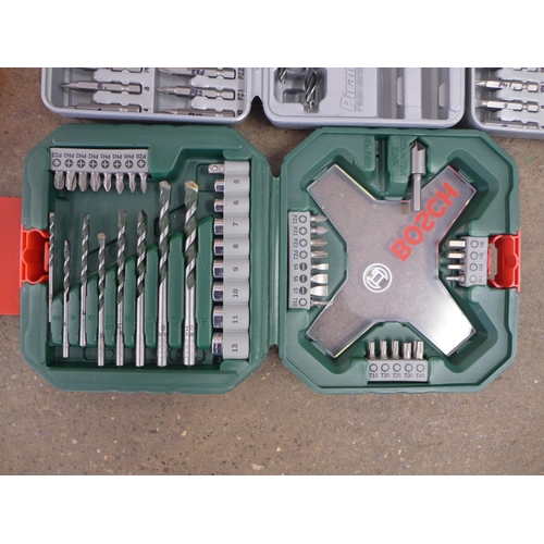 2025 - A box containing a large amount of drill bit sets