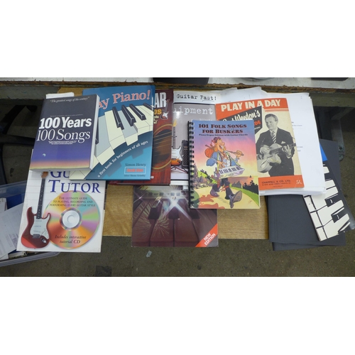 2057 - A box of music books mostly learn guitar