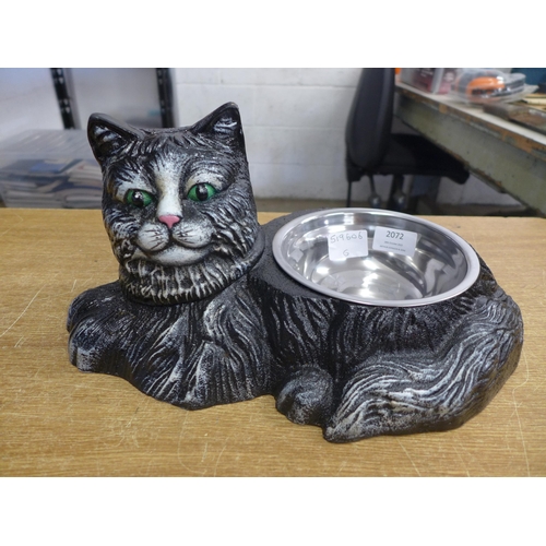 2072 - A pet food bowl  in cast cat stand* this lot is subject to VAT