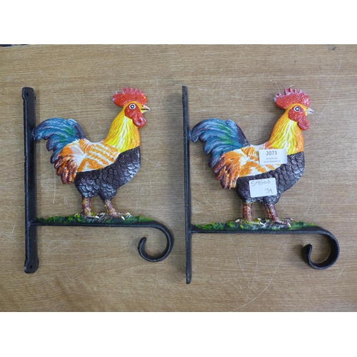 2073 - Two cockerel basket hangers * this lot is subject to VAT