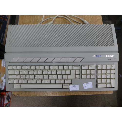 2121 - An Atari 1040 ST vintage computer system with monitor, joy stick, hand book and software etc.