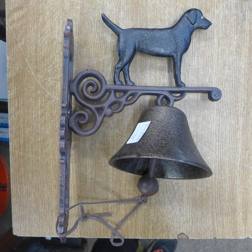 2128 - Two standing black dog bells * this lot is subject to VAT