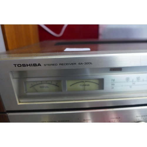 2204 - A Toshiba SA320L stereo receiver tuner and a pair of Revox BX230 speakers