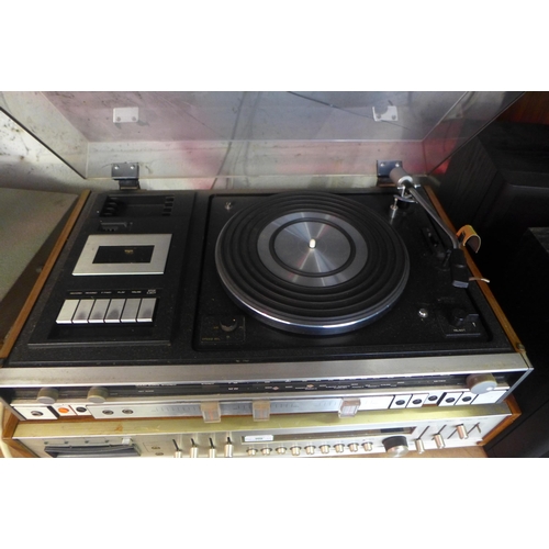 2209 - An Amerex model A4CR200 4-channel stereo receiver and a Sanyo GXT 4540K Solid State stereo sound sys... 