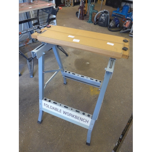 2257 - Folding work benches and a pair of tressels