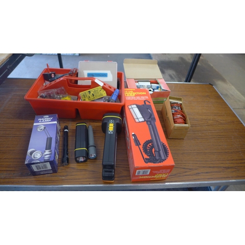 2330 - A box of assorted lights and torches with box of miscellaneous including oil cans, clips, cake joint... 