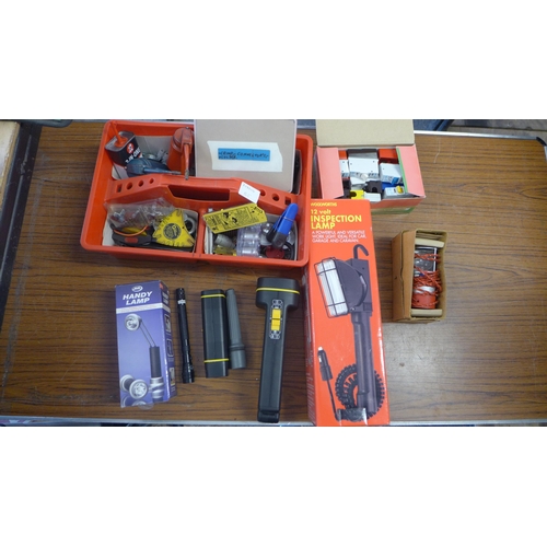 2330 - A box of assorted lights and torches with box of miscellaneous including oil cans, clips, cake joint... 