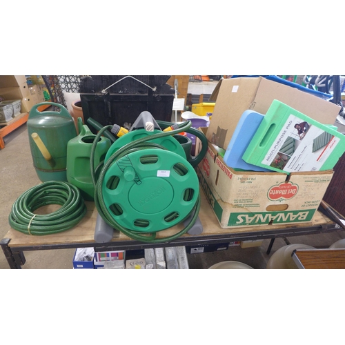 2342 - 2 Boxes of garden tools, spay bottle, kneeling pads hosepipe and reel etc and 4 watering cans