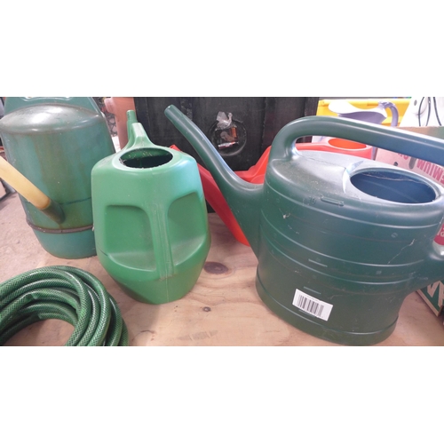 2342 - 2 Boxes of garden tools, spay bottle, kneeling pads hosepipe and reel etc and 4 watering cans